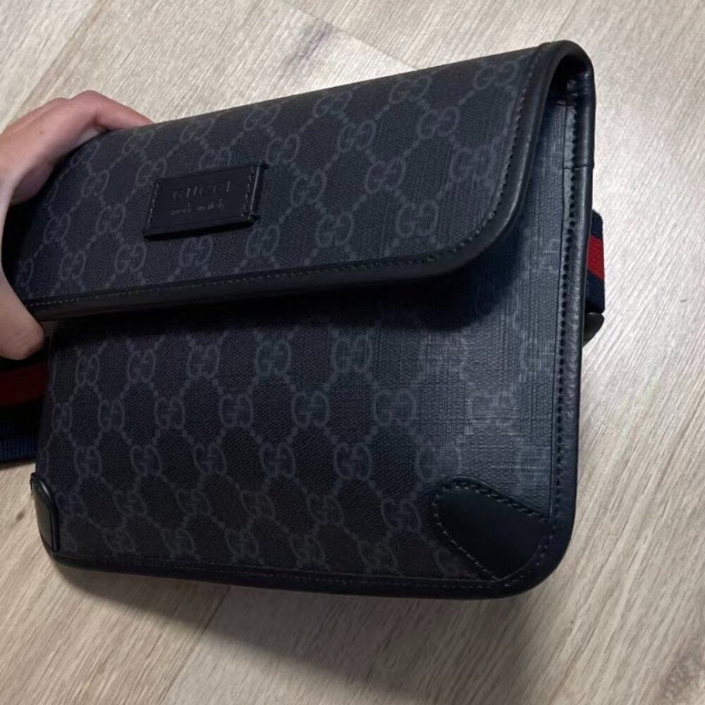 Gucci crossbody bag with webbing shoulder strap, black.